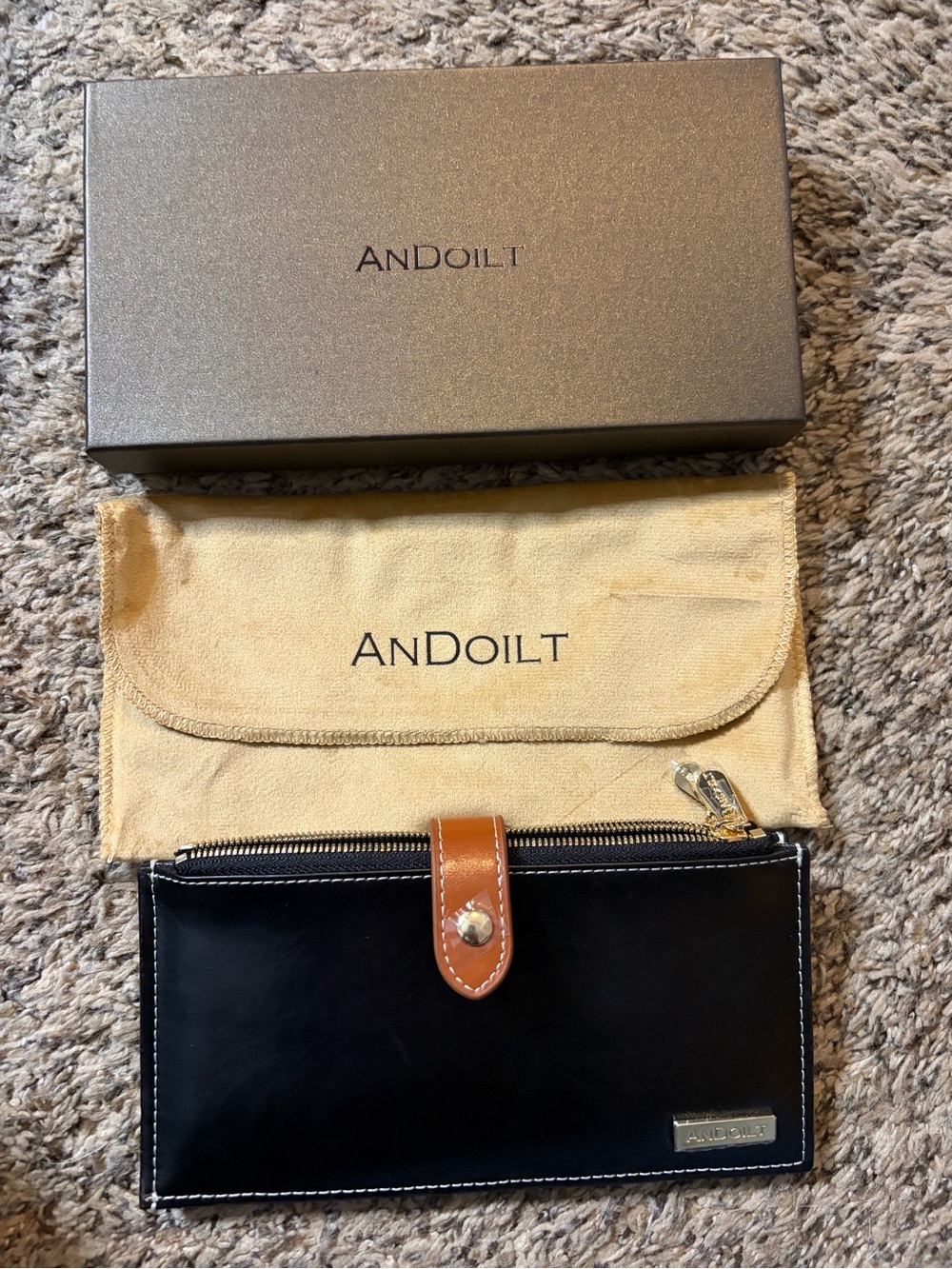 Black Leather Zip Wallet with Tan Strap Accent